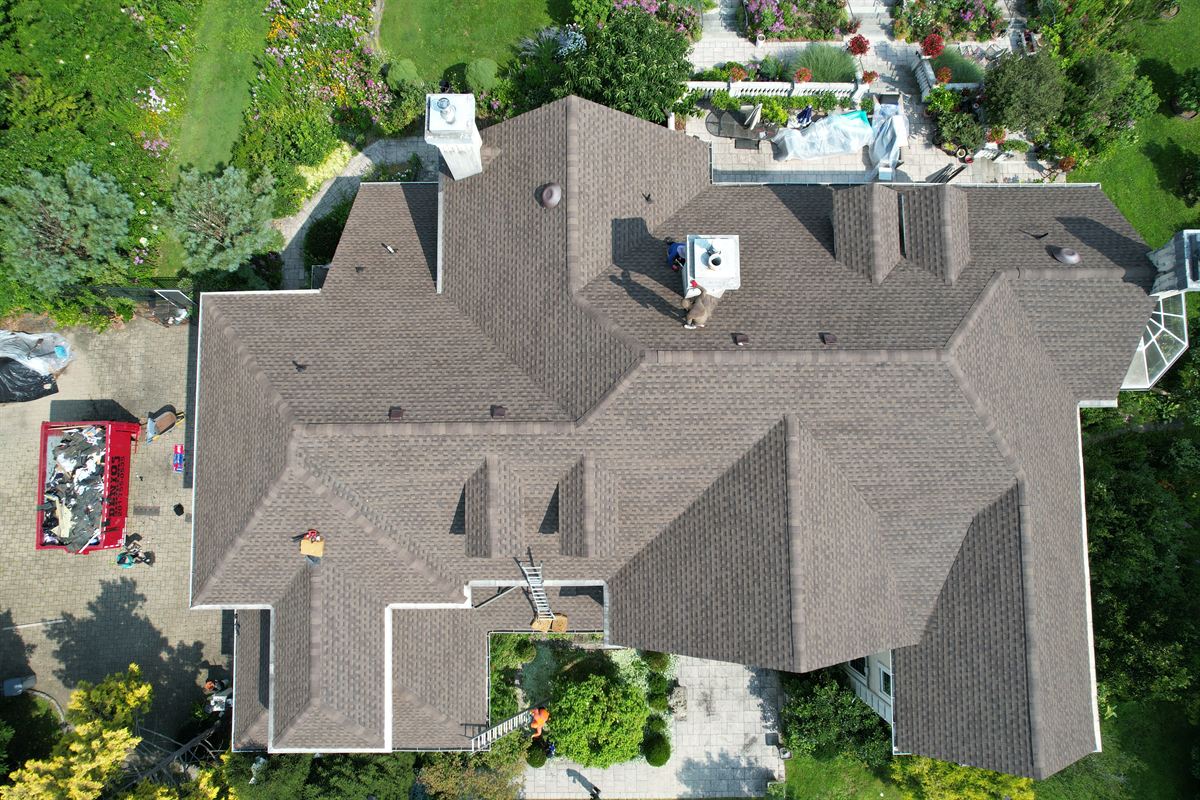 Drone view of the finished architectural shingle roof with new flashing and vents